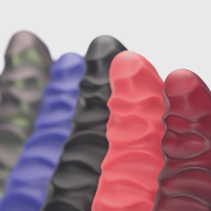 GreedyCluster ABADDON textured silicone dildo color lineup with layered armored ridges