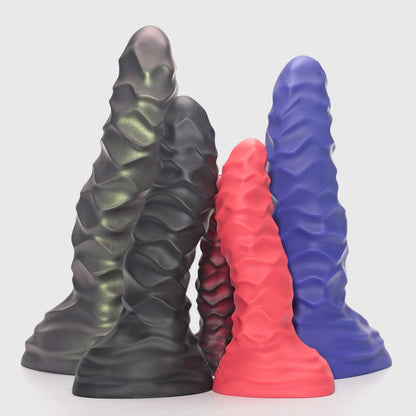 GreedyCluster ABADDON armored-ridge silicone dildo color range in Rust, Charcoal, Lava, Scarlett and Azure